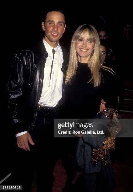 Singer Olivia Newton-John and husband Matt Lattanzi attend the 17th Annual American Music Awards on January 22, 1990 at Shrine Auditorium in Los...