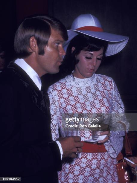 Musician Glen Campbell and Billie Jean Nunley attend Honor America Day on July 4, 1970 in Washington, D.C.