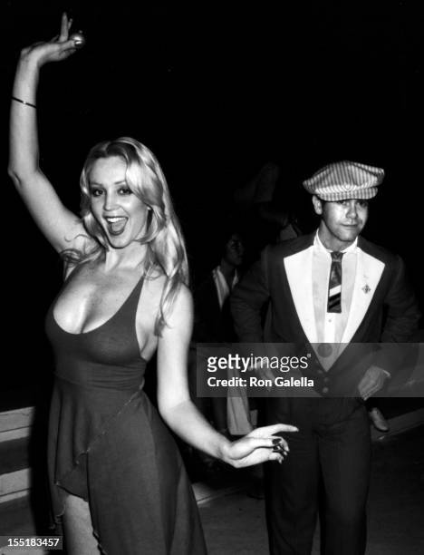 Cheryl Rixon and Elton John attend the party for Roberta Flack on June 12, 1978 at Xenon Disco in New York City.