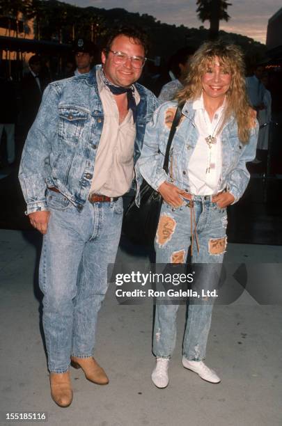 Actor Stephen Furst and wife Lorraine Wright attend the premiere of "Back To The Future III" on May 21, 1990 at the Cinerama Dome Theater in...