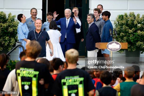 President Joe Biden waves to athletes as he, Philadelphia Union Co-President Robert Buccini and his family drop in on first lady Jill Biden's youth...