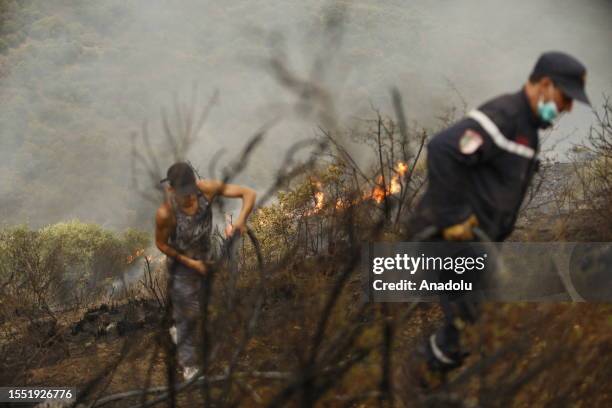 Teams deployed to combat the flames after devastating forest fires swept through several states including Bouira, Algeria on July 24, 2023. At least...