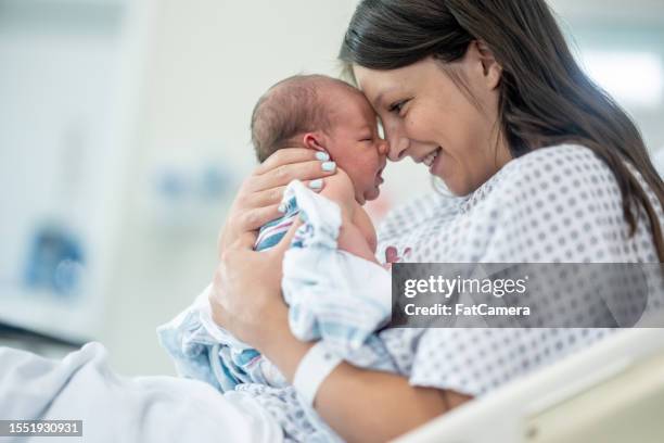 welcome little one! - childbirth stock pictures, royalty-free photos & images