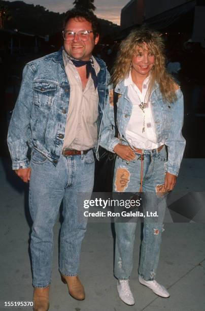 Actor Stephen Furst and wife Lorraine Wright attend the premiere of "Back To The Future III" on May 21, 1990 at the Cinerama Dome Theater in...