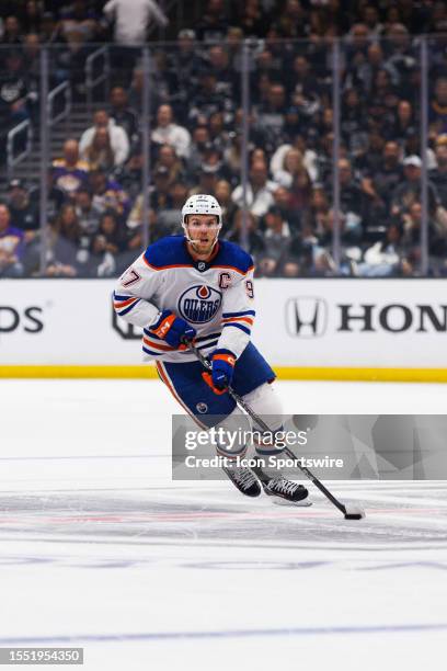 Edmonton Oilers center Connor McDavid skates with the puck during a NHL Western Conference First Round hockey game between the Edmonton Oilers and...