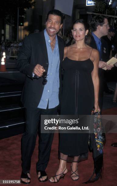 Musician Lionel Richie and Diane Alexander attend the premiere of "Lethal Weapon 4" on July 7, 1998 at Mann Chinese Theater in Hollywood, California.