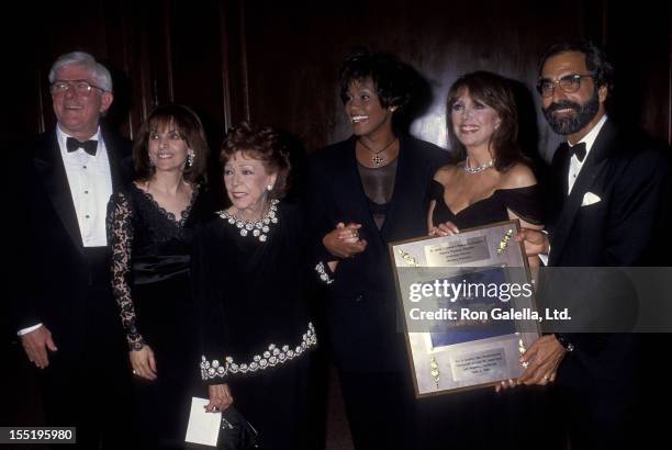 Talk show host Phil Donahue, Terre Thomas, Rose Marie Mantell, singer Whitney Houston, actress Marlo Thomas and producer Tony Thomas attend the 13th...