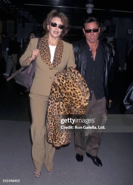 Actress Raquel Welch and boyfriend Richard Palmer depart for New York City on March 2, 1998 at the Los Angeles International Airport in Los Angeles,...