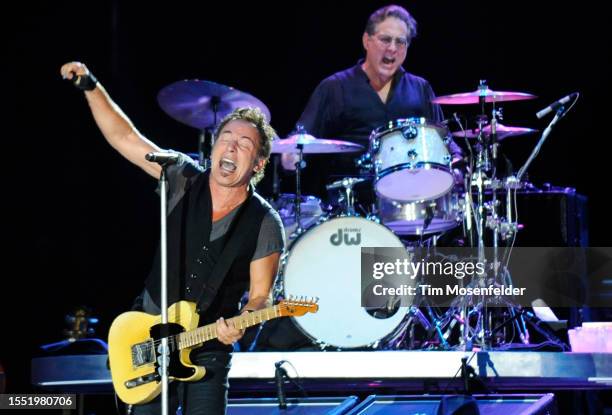 Bruce Springsteen and Max Weinberg of Bruce Springsteen and the E Street Band perform during Bonnaroo 2009 on June 13, 2009 in Manchester, Tennessee.