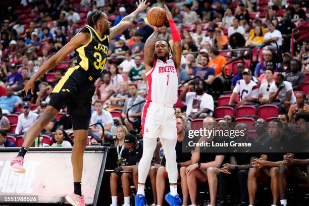 Nick Ongenda of the Utah Jazz defends against Amen Thompson of the Houston Rockets in the first half of a 2023 NBA Summer League game at the Thomas &...