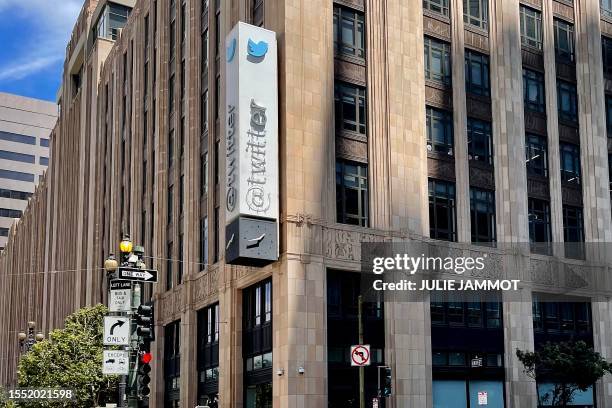 The Twitter sign is pictured after being partially removed at their headquarters building in San Francisco, California on July 24, 2023. Elon Musk...