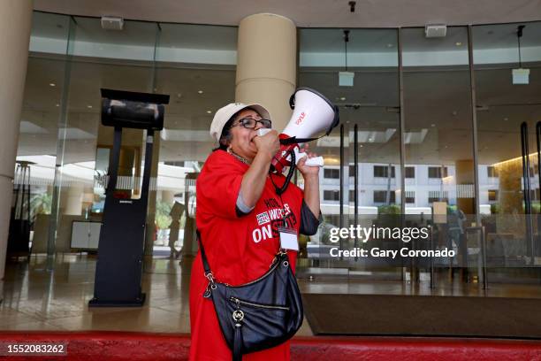 Nelly Anaya-Mena, a housekeeper at the Beverly Hilton, along with other Southern California hotel workers walk out and strike at the Beverly Hilton...