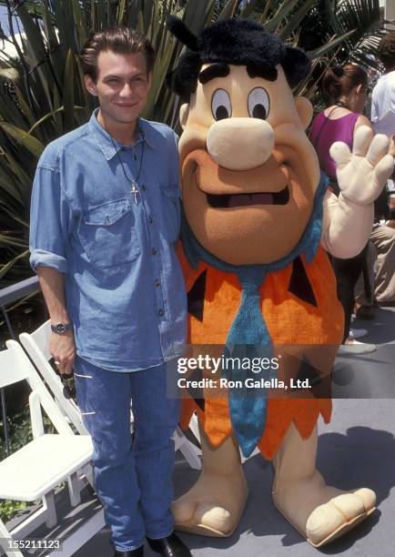 Actor Christian Slater and Fred Flintstone attend the Seventh Annual Celebrity Tennis Classic to Benefit the Make-A-Wish Foundation on August 10,...