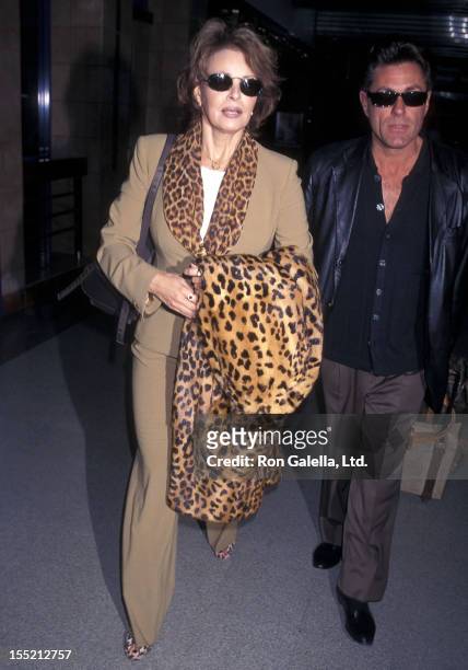Actress Raquel Welch and boyfriend Richard Palmer depart for New York City on March 2, 1998 at the Los Angeles International Airport in Los Angeles,...