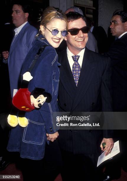 Actress Drew Barrymore and photographer Matthew Rolston attend the "Sliver" Westwood Premiere on May 19, 1993 at Mann National Theatre in Westwood,...
