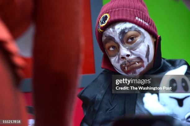 Patient Isaiah Brown watch a dog parade and halloween celebration at Children's Hospital in Washington, DC on October 31, 2012. Patients, staff and...