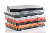Stacked DVD cases on a white background