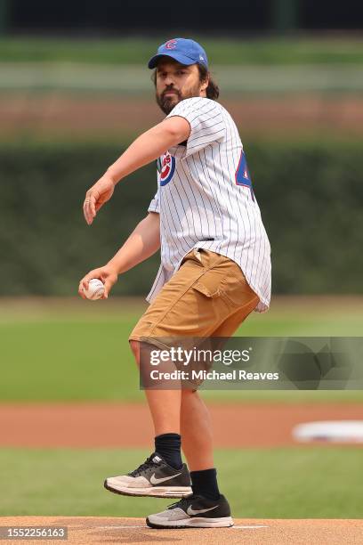 Actor Jake Johnson throws out the first pitch prior to the game between the Chicago Cubs and the Boston Red Sox at Wrigley Field on July 16, 2023 in...