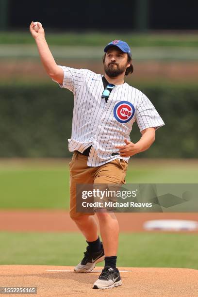 Actor Jake Johnson throws out the first pitch prior to the game between the Chicago Cubs and the Boston Red Sox at Wrigley Field on July 16, 2023 in...