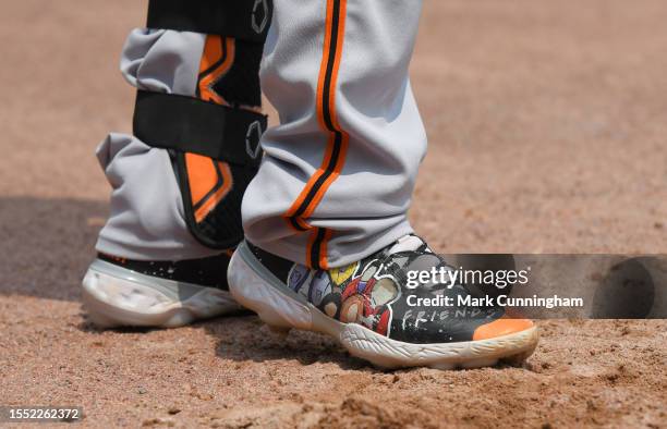 Detailed view of the custom Nike baseball shoes to honor the TV show Friends worn by Wilmer Flores of the San Francisco Giants as he waits on-deck to...