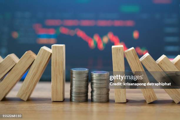 domino effect concept for business solution, strategy and successful intervention,insurance,investment  concept,stock market - fall prevention photos et images de collection