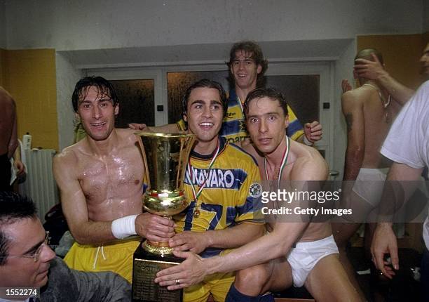 Diego Fuser, fabio Cannovaro and Enrico Chiesa of Parma celebrate victory in the Coppa Italia Cup Final match against Fiorentina played in...