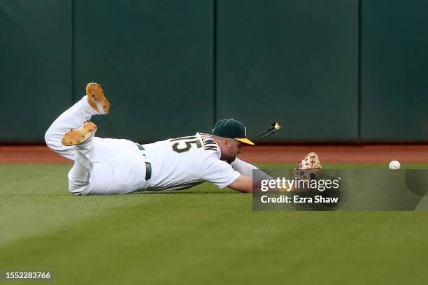 Seth Brown of the Oakland Athletics can not catch a ball hit by Justin Turner of the Boston Red Sox in the sixth inning at RingCentral Coliseum on...