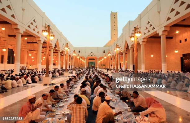 Muslim workers break their fast on the first Friday of Ramadan at the Imam Turki bin Abdullah mosque in Riyadh, 14 September 2007. The world's 1.2...