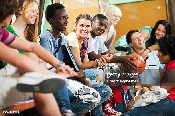 group of students relaxing during the school break. - sports hall stock pictures, royalty-free photos & images