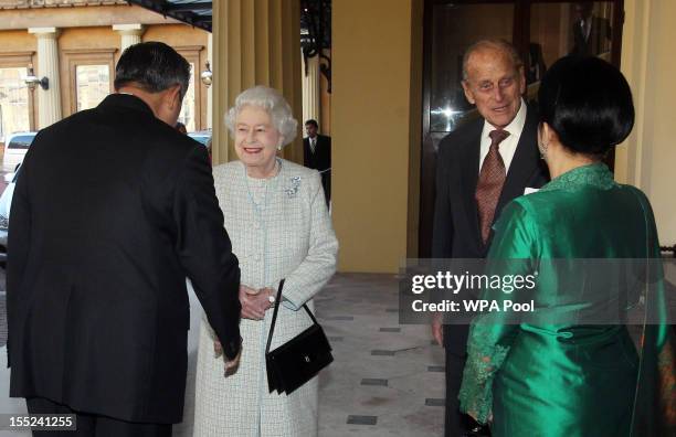 Queen Elizabeth II and the Prince Philip, Duke of Edinburgh say farewell to Indonesian President Susilo Bambang Yudhoyono and his wife Ani Bambang...