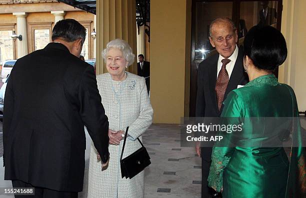 Britain's Queen Elizabeth II and Prince Philip, Duke of Edinburgh say farewell to Indonesian President Susilo Bambang Yudhoyono and his wife First...