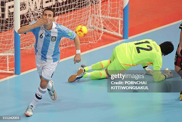 Maximiliano Rescia of Argentina celebrates after scoring a goal against Mexico during their first round futsal indoor football match of the FIFA...