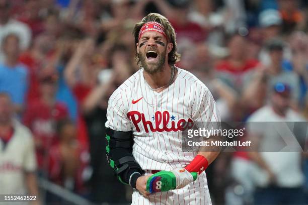 Bryce Harper of the Philadelphia Phillies reacts after getting tagged out at home to end the eighth inning against the Baltimore Orioles at Citizens...