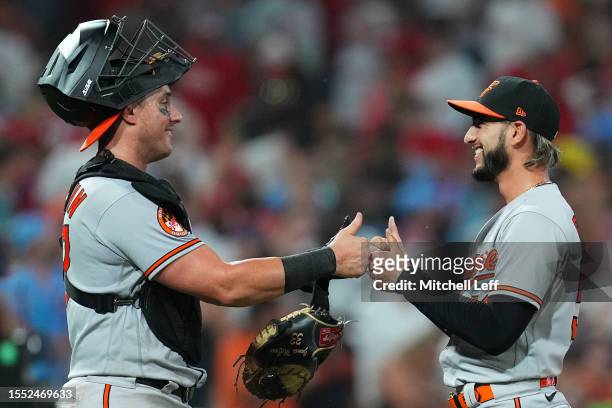 James McCann of the Baltimore Orioles celebrates with Cionel Perez after the game against the Philadelphia Phillies at Citizens Bank Park on July 24,...