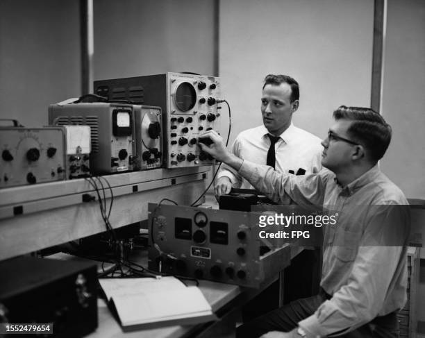 Professor observes as a student adjusts a dial on a Cathode-Ray Oscilloscope , among other equipment in a Susquehanna University lab in Selinsgrove,...