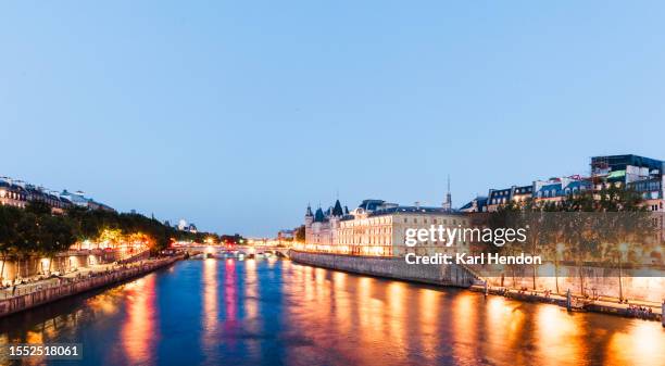 a dusk view of the seine river, paris - paris france skyline stock pictures, royalty-free photos & images