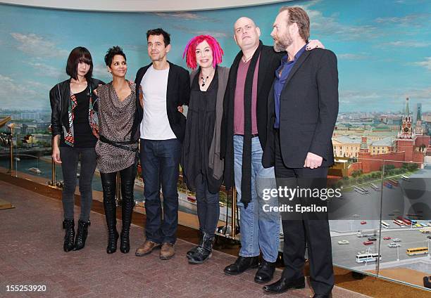 Doona Bae, Halle Berry, Tom Tykwer, Lana Wachowski, Andy Wachowski and Hugo Weaving pose for photographers during the 'Cloud Atlas' film photocall at...