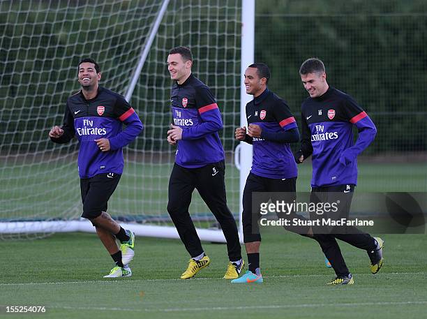 Andre Santos, Thomas Vermaelen, Theo Walcott and Aaron Ramsey of Arsenal during a training session at London Colney on November 2, 2012 in St Albans,...