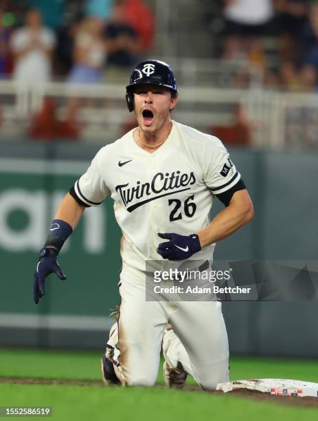 Max Kepler of the Minnesota Twins reacts to his double forcing an RBI against the Seattle Mariners in the ninth inning at Target Field on July 24,...