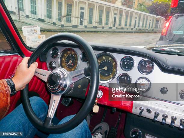 person driving car -  drivers point of view through windshield - classic car point of view stock-fotos und bilder