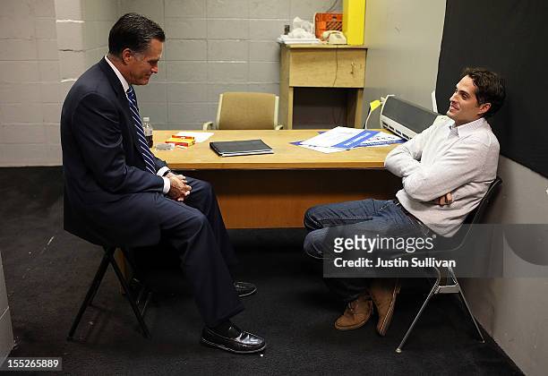 Republican presidential candidate, former Massachusetts Gov. Mitt Romney sits backstage with his son Craig Romney before a campaign rally at the...