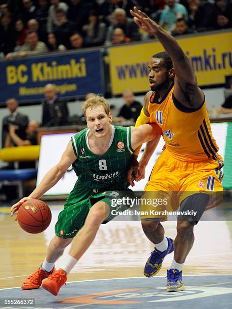 Jaka Blazic, #8 of Union Olimpija Ljubljana competes with Kelvin Rivers, #11 of BC Khimki Moscow Region during the 2012-2013 Turkish Airlines...