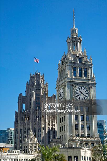 buttresses and clocktower near office tower tops. - tribune tower stockfoto's en -beelden