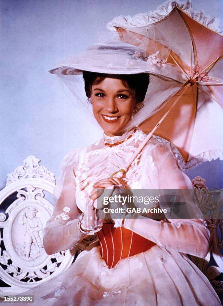 Photo of English actress Julie Andrews dressed as the title character from the 1964 film Mary Poppins.