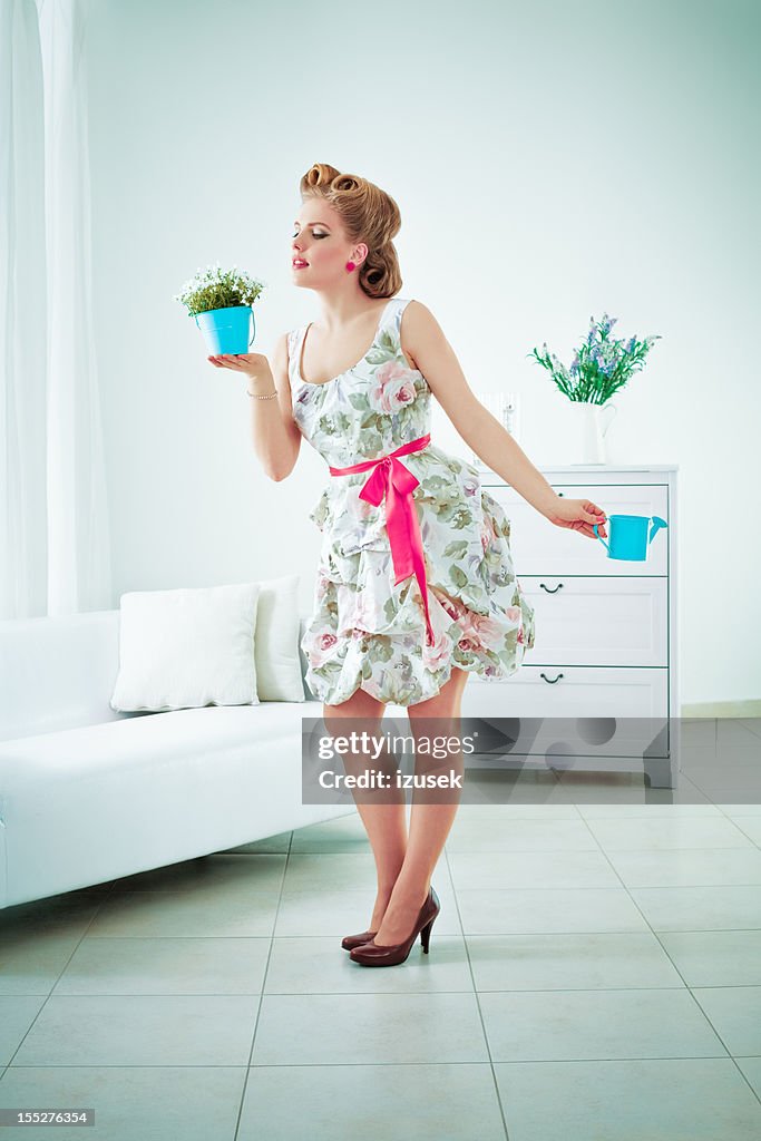 Retro woman watering flower