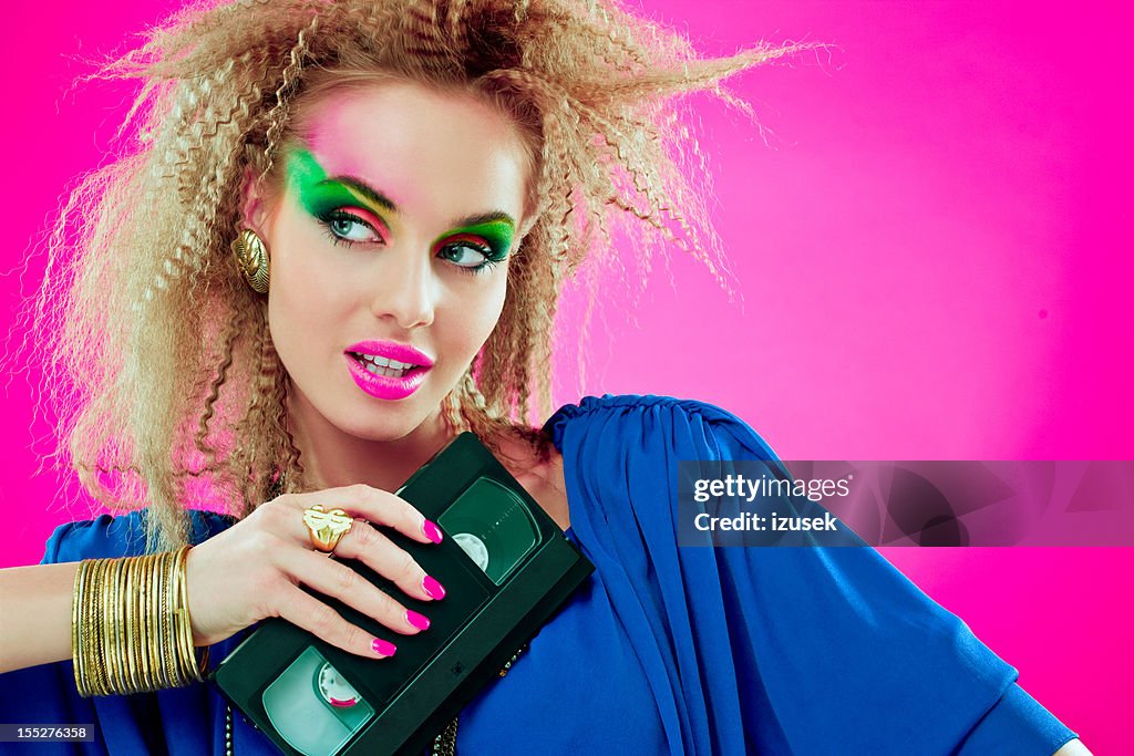 80s beautiful woman with video tape