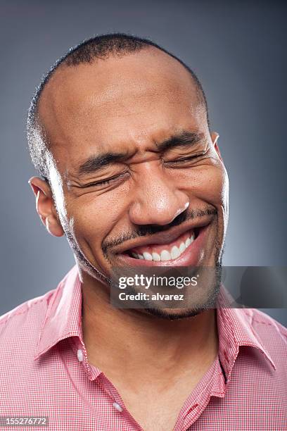 portrait of a man suffering pain - squinting stock pictures, royalty-free photos & images