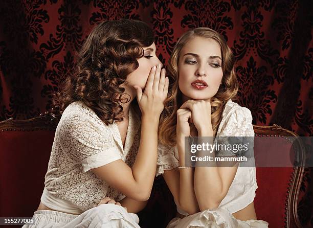 gossips - 1900s woman stockfoto's en -beelden