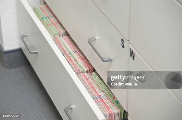 patient documents - medical record - filing documents stock pictures, royalty-free photos & images