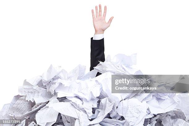 a man covered with tones of torn paper  - project failure stock pictures, royalty-free photos & images